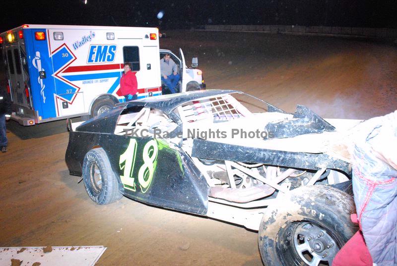 Sport Mod car number 18 of John Ingelhart sits on the track after hitting the wall and rolling at Oklahoma Sports Park.